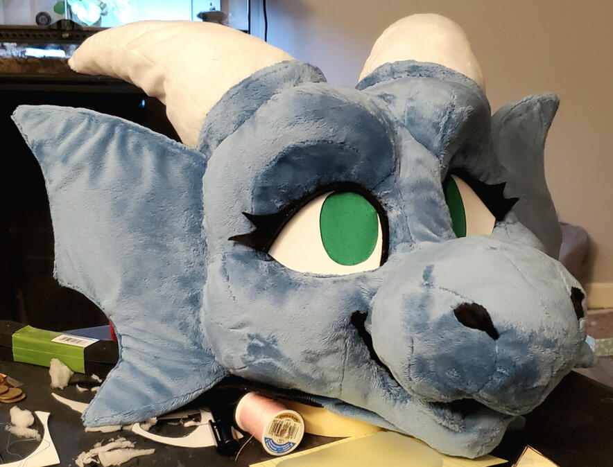 droghlin1 The head of Droghlin, a dusky blue dragon with short white horns.