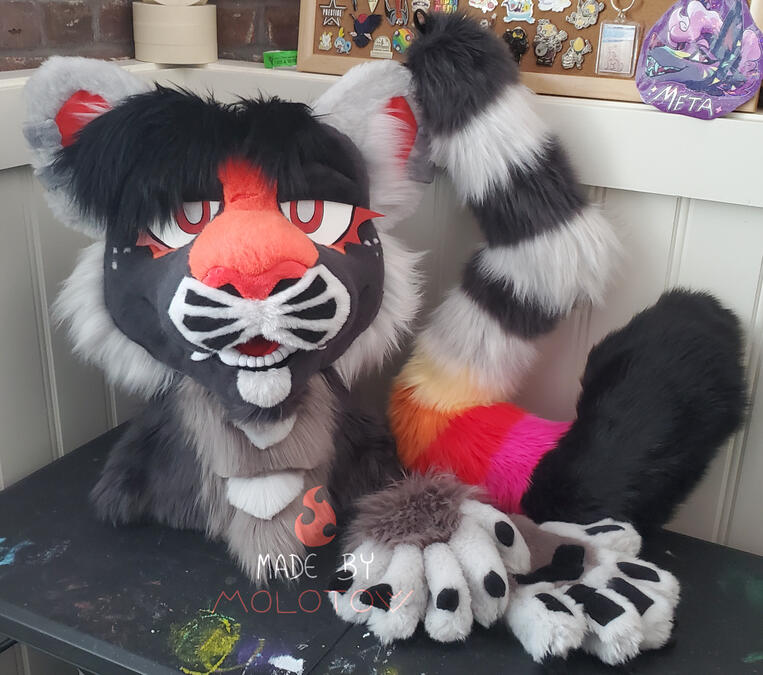 AXIOM1 The fursuit head, handpaws, and tail of Axiom, a tiger character.